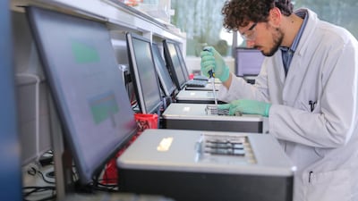 A scientist at Oxford Nanopore lab. Abu Dhabi’s International Holdings Company said on Tuesday it is investing £39 million in Oxford Nanopore Technologies. Courtesy: Oxford Nanopore