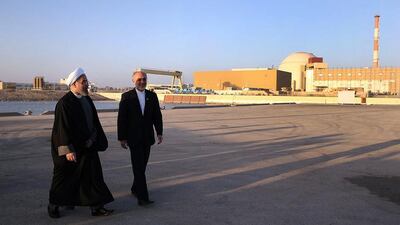 Iranian President Hassan Rouhani walks alongside Iran's Atomic Energy Organisation chief Ali Akbar Salehi at the Bushehr nuclear power plant (AFP PHOTO / IRANIAN PRESIDENCY WEBSITE / MOHAMMAD BERNO)