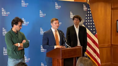Jacon Helberg, undersecretary of state for economic affairs, centre, speaks on the White House's AI strategy. He is joined by venture capitalist Christian Garrett on the left and Varda founder Delian Asparouhov on the right. Cody Combs / The National