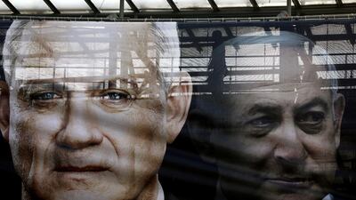 A banner depicts Benny Gantz, leader of Blue and White party, and Israel's incumbent Prime minister Benjamin Netanyahu. REUTERS
