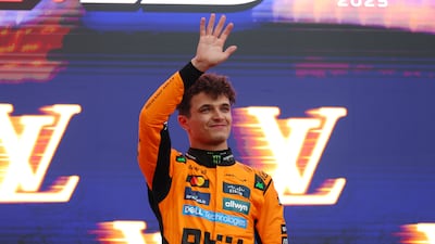 Race winner Lando Norris of Great Britain and McLaren waves from the podium during the F1 Grand Prix of Australia at Albert Park on March 16, 2025. Getty Images