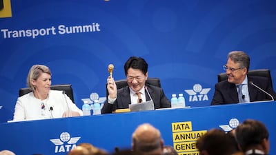 Walter Cho, president of Korean Air Lines , centre, hits a gavel during the IATA annual general meeting in Seoul, South Korea. Bloomberg