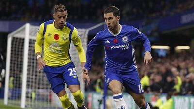 Chelsea's Eden Hazard, right, vies for the ball with Everton's Ramiro Funes Mori. Kirsty Wigglesworth / AP Photo