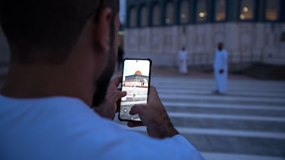 Worshippers arrive on the first morning of Eid Al Adha at Bani Hashim Mosque in Abu Dhabi. Victor Besa / The National