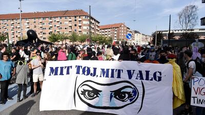 People hold a banner that reads: My clothes my choice. EPA