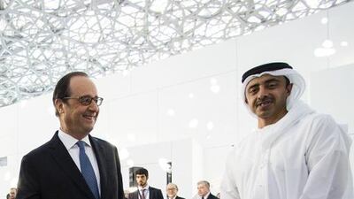 Sheikh Abdullah bin Zayed, Minister of Foreign Affairs, tours the Louvre Abu Dhabi construction site with French president Francois Hollande in December. Christopher Pike / The National