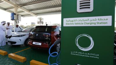 Electric cars on display during the launch of electric car charging station at DEWA headquarters in Garhoud in Dubai. Pawan Singh / The National