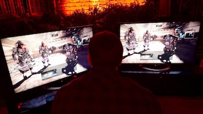 Guests play "Killing Zone - Shadow Fall" on Sony's PlayStation 4 during a pre-launch event for the latest gaming console in New York. The PlayStation 4 is set to launch in the US on November 15. Emmanuel Dunand / AFP
