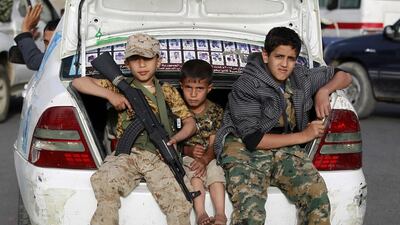 Humanitarian and security experts have said recruitment of child soldiers, such as these Yemeni children photographed this year during a pro-Houthi march in Sanaa, is on the increase. Mohammed Huwais / AFP