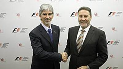British Racing Drivers Club President Damon Hill, left, shakes hands with the Managing Director of the Silverstone race circuit Richard Phillips after announcing Silverstone will host the British Grand Prix for the next 17 years.