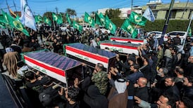 Mourners attend a funeral for members of Iraq's PMF in Baghdad. AFP