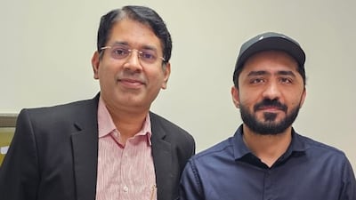 Emad Arif Khan, right, with Dr Prakash Nair, the consultant neurosurgeon who led his surgery. Photo: Aster DM Healthcare