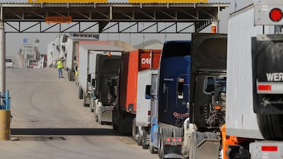 FILE PHOTO - Trucks wait in a long queue for border customs control to cross into the U.S. at the Otay border crossing in Tijuana, Mexico, February 2, 2017. REUTERS/Jorge Duenes/File Photo