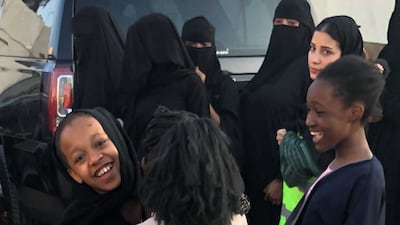 Saudi volunteers of Live to Give spread joy and Eid gifts in less privileged neighborhoods in Jeddah. Mariam Nihal / The National