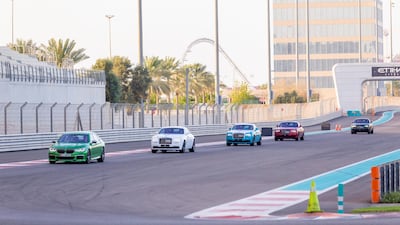 The pace cars leads the second pack towards the corkscrew bend. Courtesy Abu Dhabi Motors