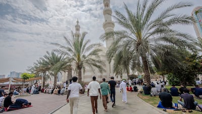 Worshippers gather for Friday prayers at Al Qasba mosque in Sharjah. Ahmed Ramzan / The National