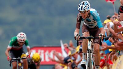 France's Romain Bardet crosses the finish line to win the 12th stage of the Tour de France.
