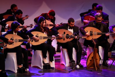 Iraqi musicians play the Oud at a concert in Iraq's capital Baghdad, on December 17, 2021. AFP