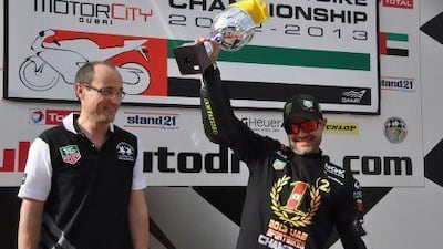 Motorcity UAE Sportbikes champion Mahmoud Tannir celebrates on the podium with Luc Decroix, General Manager TAG Heuer Middle East.