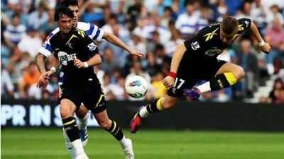Ivan Klasnic, right, of Bolton controls the ball as teammate Chris Eagles looks on against Queens Park Rangers at Loftus Road.