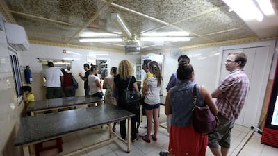 Customers queue to place their order. Each evening the queues begin, in anticipation of the 7pm opening.