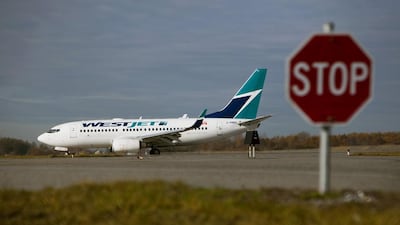 A Westjet aircraft taxis at Vancouver International Airport in Canada
