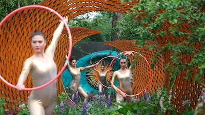 Dancers perform in The David Harber and Savills Garden at the 2018 Chelsea Flower Show in London.