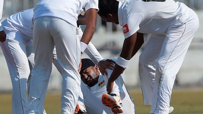 Sri Lanka's Dimuth Karunaratne got hurt during the fifth day of the first Test against Pakistan in Rawalpindi. AFP