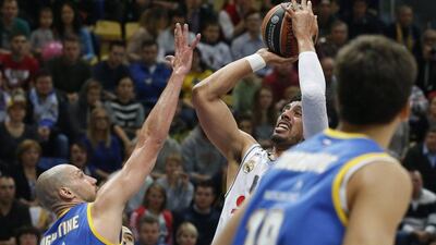 Gustavo Ayon of Real Madrid attempts a shot over James Augustine of BC Khimki during his team’s Euroleague loss in Russia on Friday night. Maxim Shipenkov / EPA