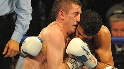 Amir Khan and Paul McCloskey clash heads resulting in a cut for McCloskey and the referee stopping the fight.
