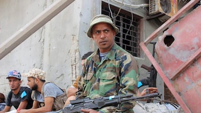 Fighters of Libyan forces allied with the UN-backed government rest near front line of fighting with ISIL militants in Ghiza Bahriya district in Sirte, Libya on November 16, 2016. Ayman Sahely/Reuters