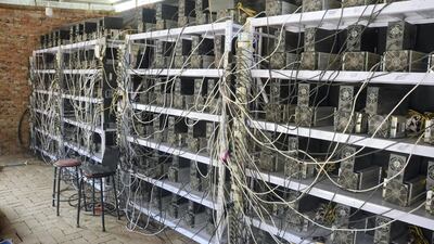 Bitcoin mining machines, running on power obtained illegally, in a house in Yan'an, in the Shaanxi Province of China, in August. Over 1,600 bitcoin mining machines were seized by police. The machines were powered by illegally obtained electricity from inter-mountain oil fields in Yan'an. Zhang Jianquan/Huashang Daily/VCG