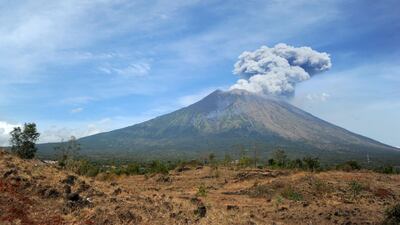 A plume of fresh ash is released as Mount Agung volcano erupts, in this image seen from the village of Tulamben in Karangasem Regency on Indonesia's resort island of Bali. Sonny Tumbelaka / AFP