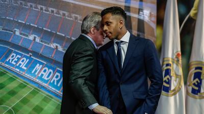 Rodrygo shakes hands with Real Madrid President Florentino Perez. AP Photo