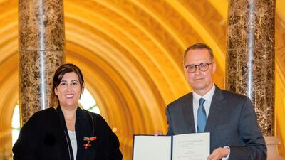 Manal Ataya, director general of Sharjah Museums Authority, receives the Order of Merit from Ernst Peter Fischer, German ambassador to the UAE, at the Sharjah Museum of Islamic Civilisation. Photo; Sharjah Museums Authority