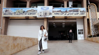 A journalist walks at Aleppo international airport which has reopened for the first time in years, in Syria. Reuters