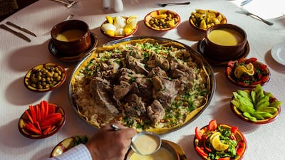 Mansaf consists of lightly-spiced marinated lamb or chicken that is boiled and then simmered slowly in a yogurt-based sauce. Blaine Harrington III / Alamy Stock Photo