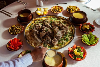 Mansaf consists of lightly spiced marinated lamb or chicken simmered in a yogurt-based sauce. Photo: Blaine Harrington III / Alamy Stock Photo