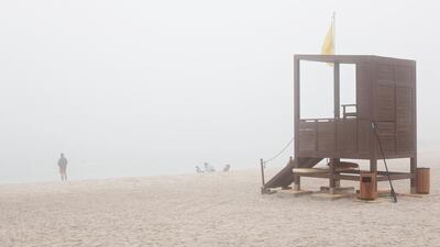 Fog envelops Al Muneera beach on Monday morning. Deepthi Unnikrishnan / The National