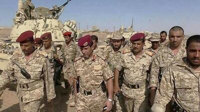 Commander Abdul Rab Al Shaddadi of the Yemen army's Third Military Region, second from left, and Brigadier General Murad Turaiq, second from right, chief of the Yemeni military in Marib and Al Bayda, with their troops in Marib province yesterday. Courtesy of Mohammed Al Qalisi