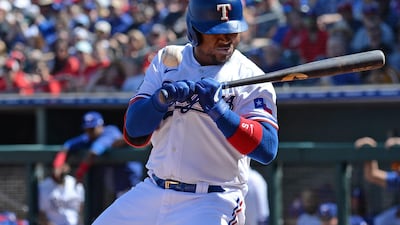 Texas Rangers left fielder Willie Calhoun suffers a broken jaw after being hit in the face by a pitch against the Los Angeles Dodgers during the first innings of a spring training game at Surprise Stadium in Arizona. USA TODAY Sports