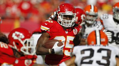 Jamaal Charles, centre, carries the load on the ground and through the air for Kansas City Chiefs. Colin E. Braley / AP Photo