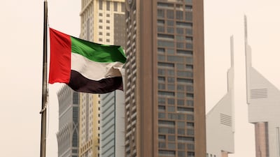 The UAE flag on display in Downtown, Dubai. Chris Whiteoak / The National