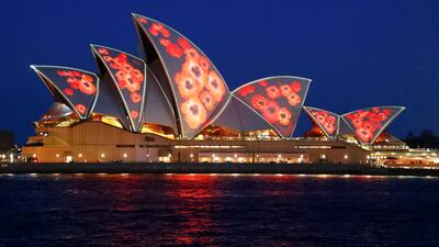 Red poppies are projected onto the sails of the Sydney Opera House to mark the centenary of the Armistice ending World War One, in Sydney, Australia. Reuters