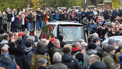 Thousands of fans pay their respects as the cortege of football great Sir Bobby Charlton makes its way to the funeral service at Manchester Cathedral. AP