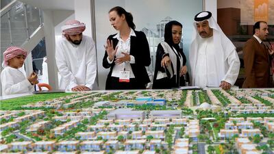 Prospective buyers get a briefing on the Al Reef-2 project by Manazel Properties. Ravindranath K / The National