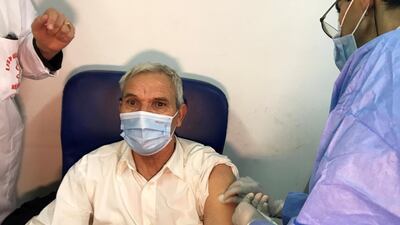 A man receives an injection with Sputnik V vaccine against Covid-19. Reuters