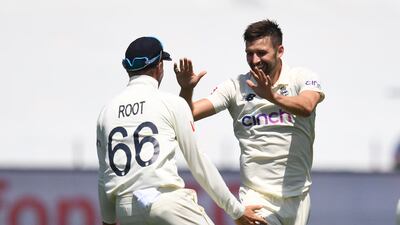 Englland's Mark Wood celebrates taking the wicket of Mitchell Starc for three in Australia's first innings. PA