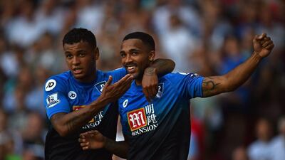 Bournemouth’s Callum Wilson, right, celebrates with teammate Joshua King on Saturday during his three-goal performance in a win against West Ham. Ben Stansall / AFP