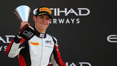 GP3 ART Grand Prix's French driver Esteban Ocon celebrates winning the 2015 title on the podium at the Yas Marina Circuit in Abu Dhabi on Sunday. Marwan Naamani / AFP